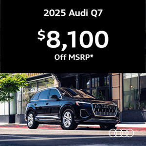 Audi Q7 parked by building