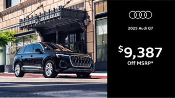 Quarter image of Q7 driving by building