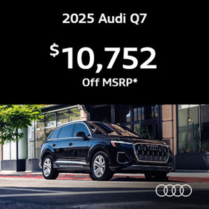 Audi Q7 Premium driving by tree
