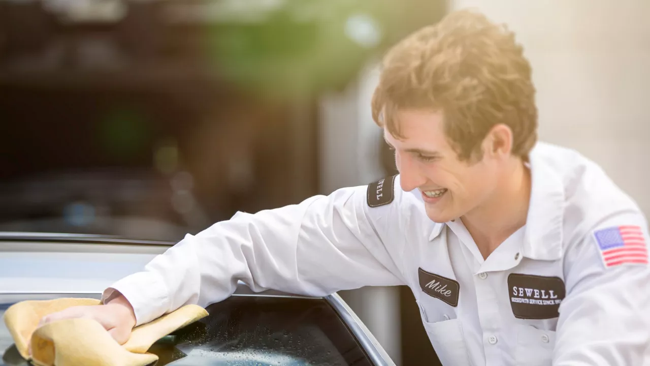 Audi service technician servicing a vehicle.