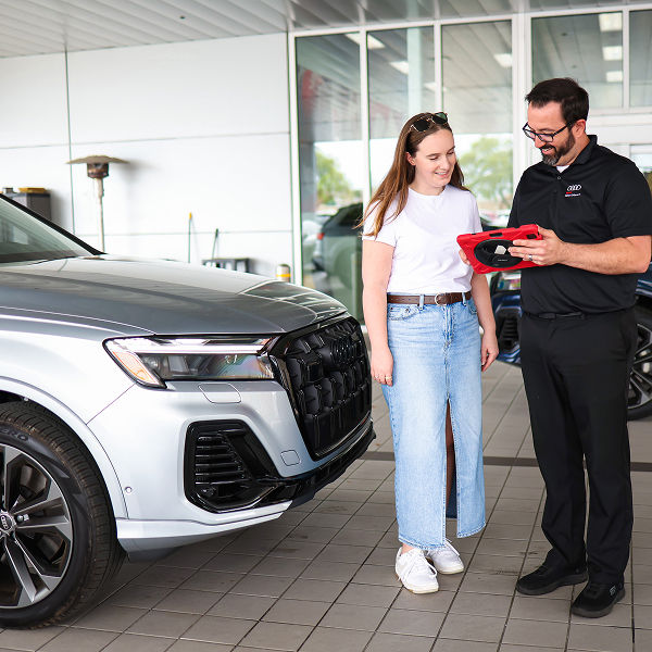Rear profile view of an Audi Q5 parked.