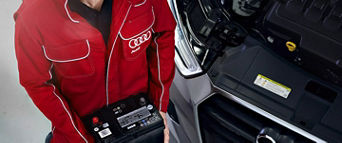 Service technician serving vehicle.