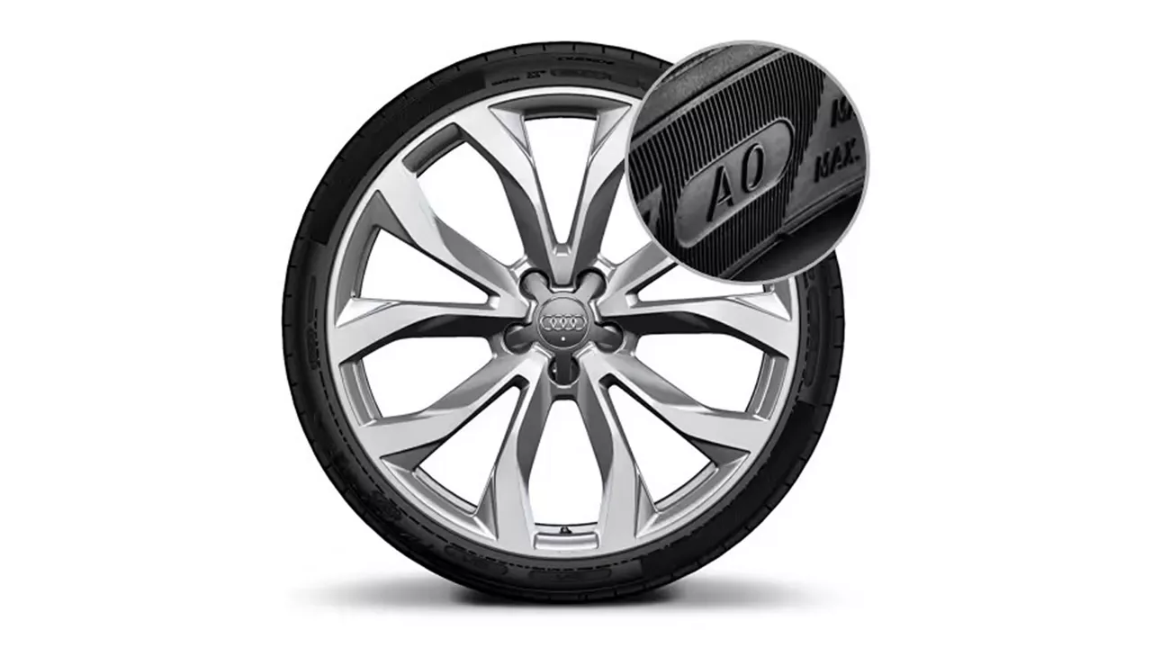 Right side profile view of an Audi Q8 SUV parked.