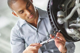 Service technician serving brakes.