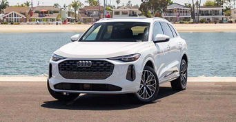 Audi parked in front of the water