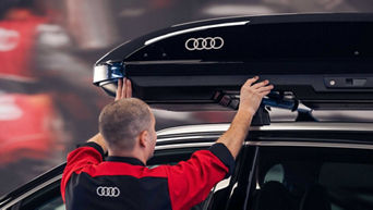 Service technician servicing vehicle.