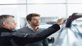 Service technician servicing vehicle.