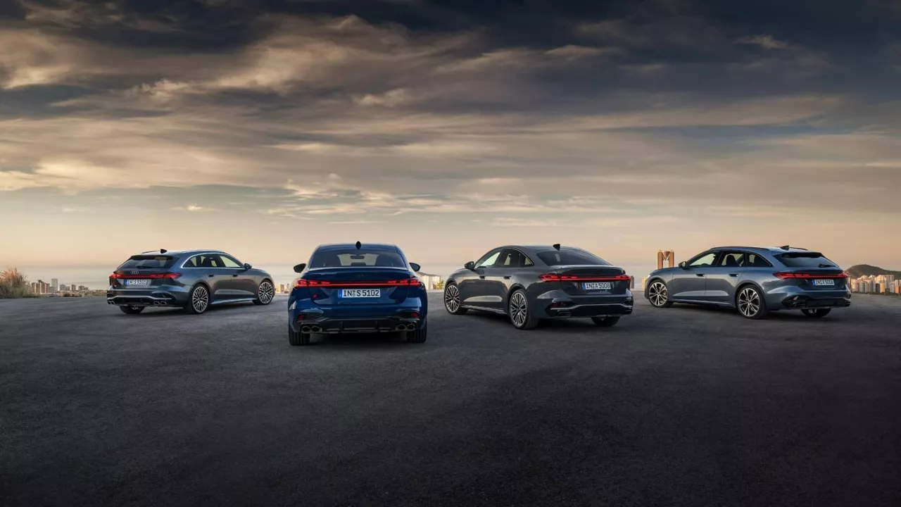 Rear profile view of four audi sedan vehicles parked.