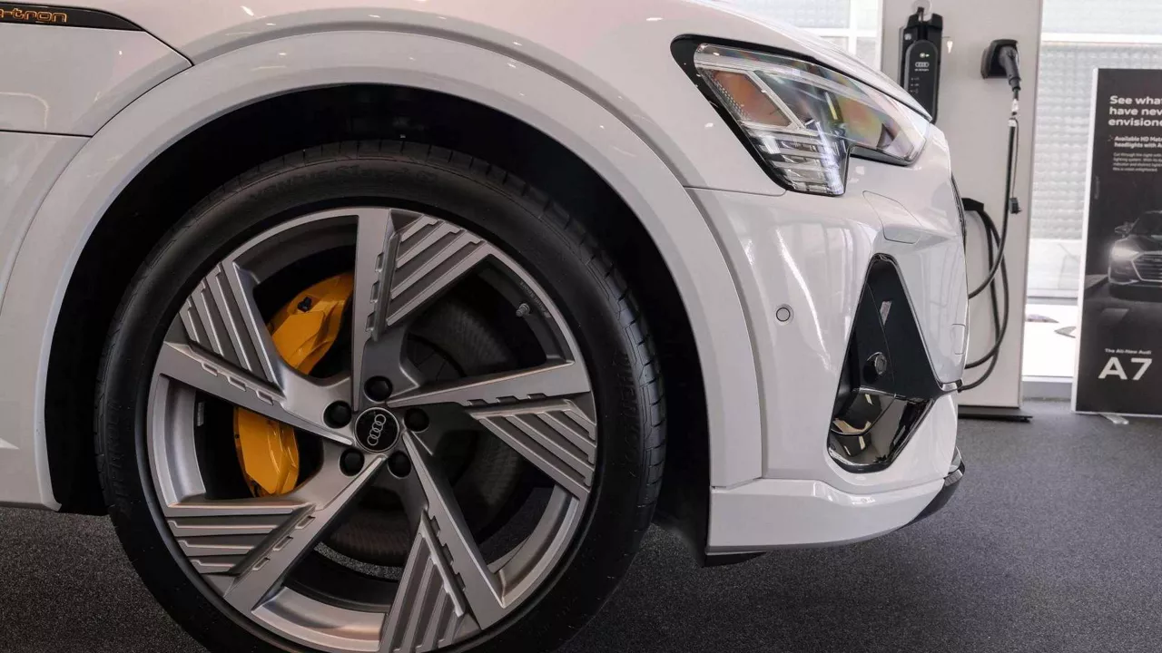 Right profile view of an Audi vehicle parked.