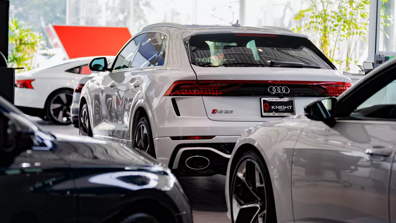 Rear profile view of an Audi vehicle parked.