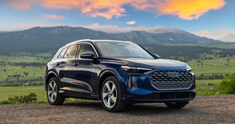 All New 2025 Audi Q5 Specs in blue parked on dirt mountain road