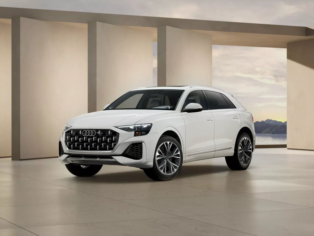 2026 Audi Q8 trim level Premium in white parked by modern structure
