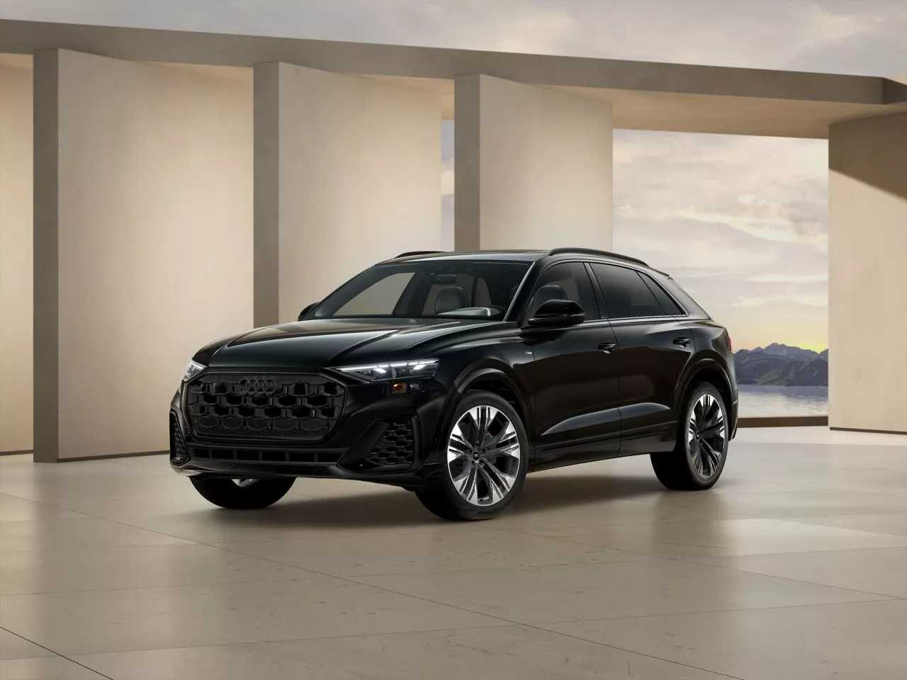 2026 Audi Q8 trim level Premium Plus in black parked by modern structure