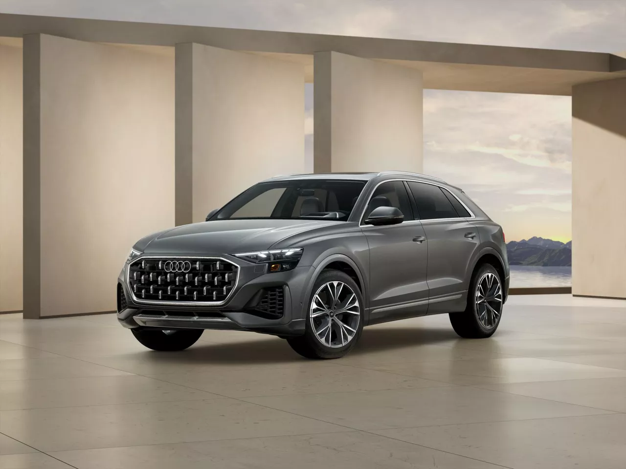 2026 Audi Q8 trim level Prestige in Gray parked by modern structure