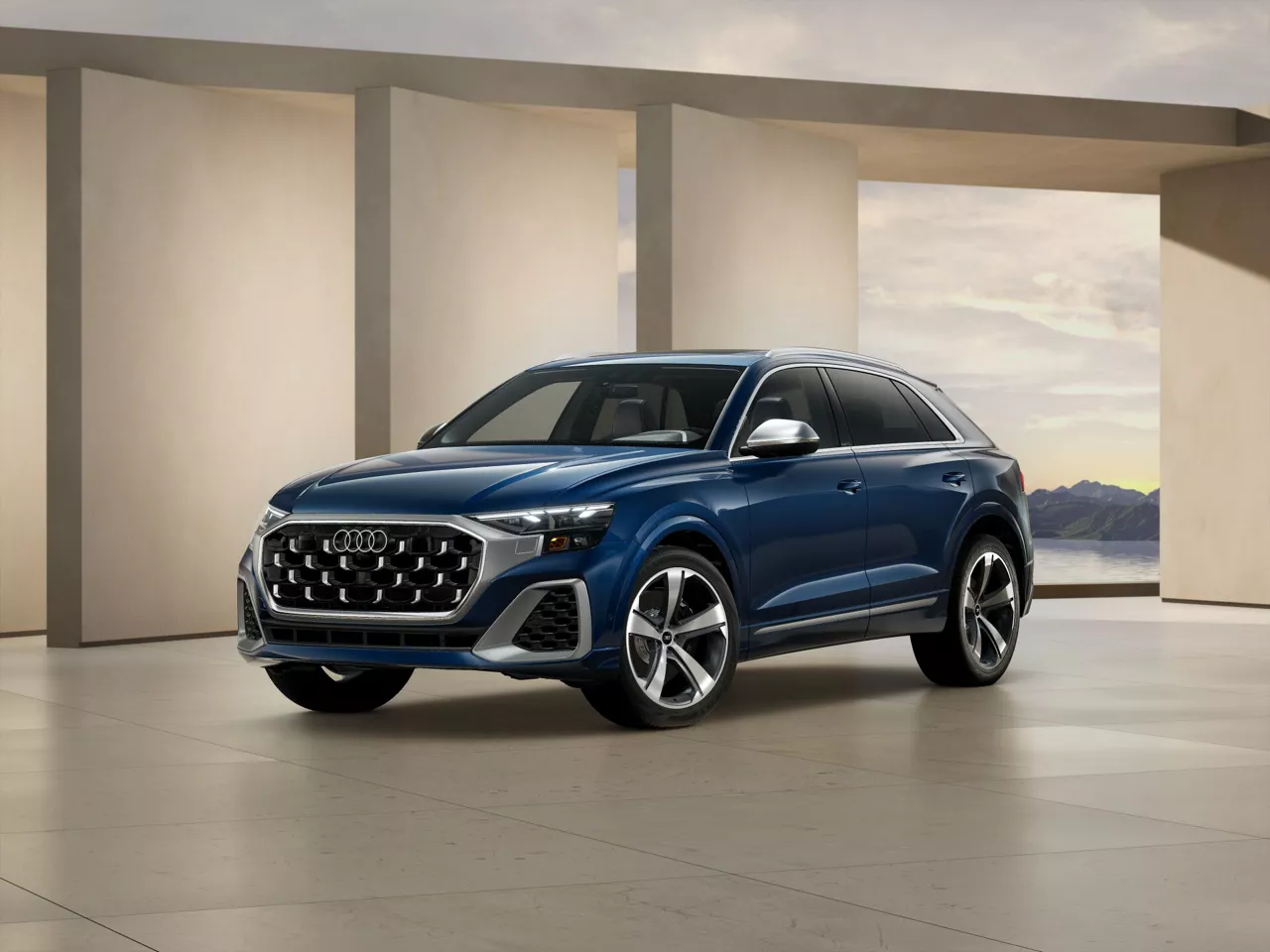 2026 Audi SQ8 trim level Premium Plus in blue parked by modern structure