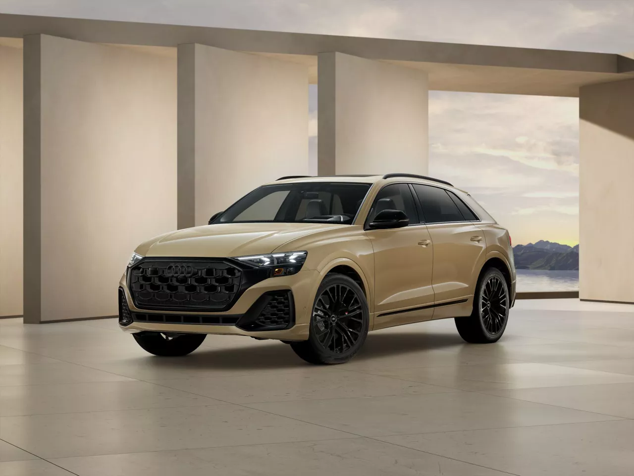 2026 Audi SQ8 trim level Prestige in gray parked by modern structure