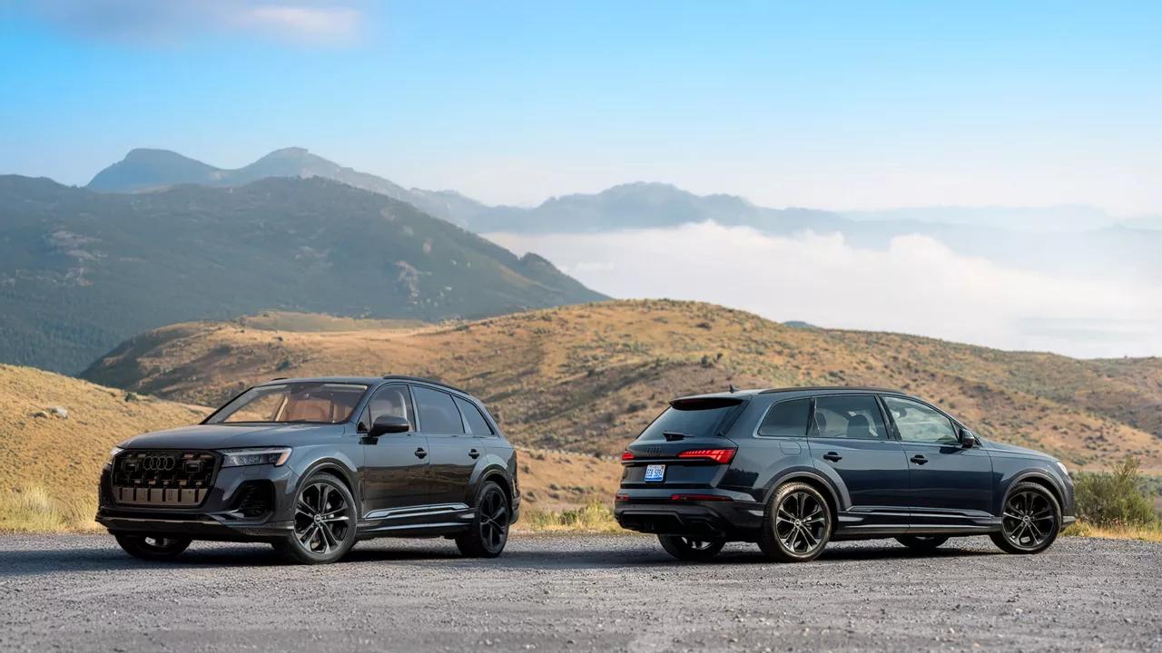 Two 2026 Audi Q7s parked front to back with arid mountain background