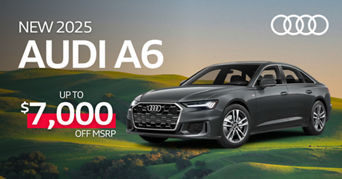 Left side profile of an Audi A6 accelerating.