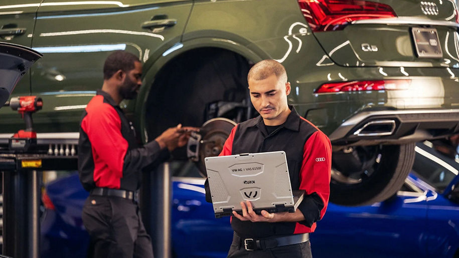 Audi technician observing a laptop.