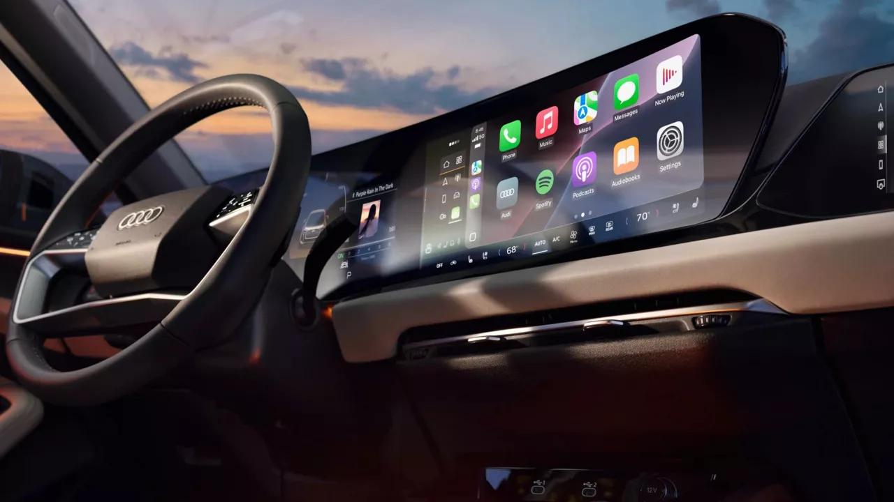 Interior view of an Audi steering wheel and dashboard.