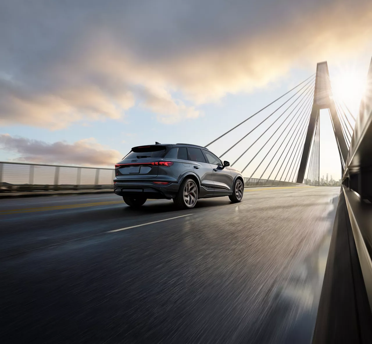 Audi SQ6 e-tron rear view driving
