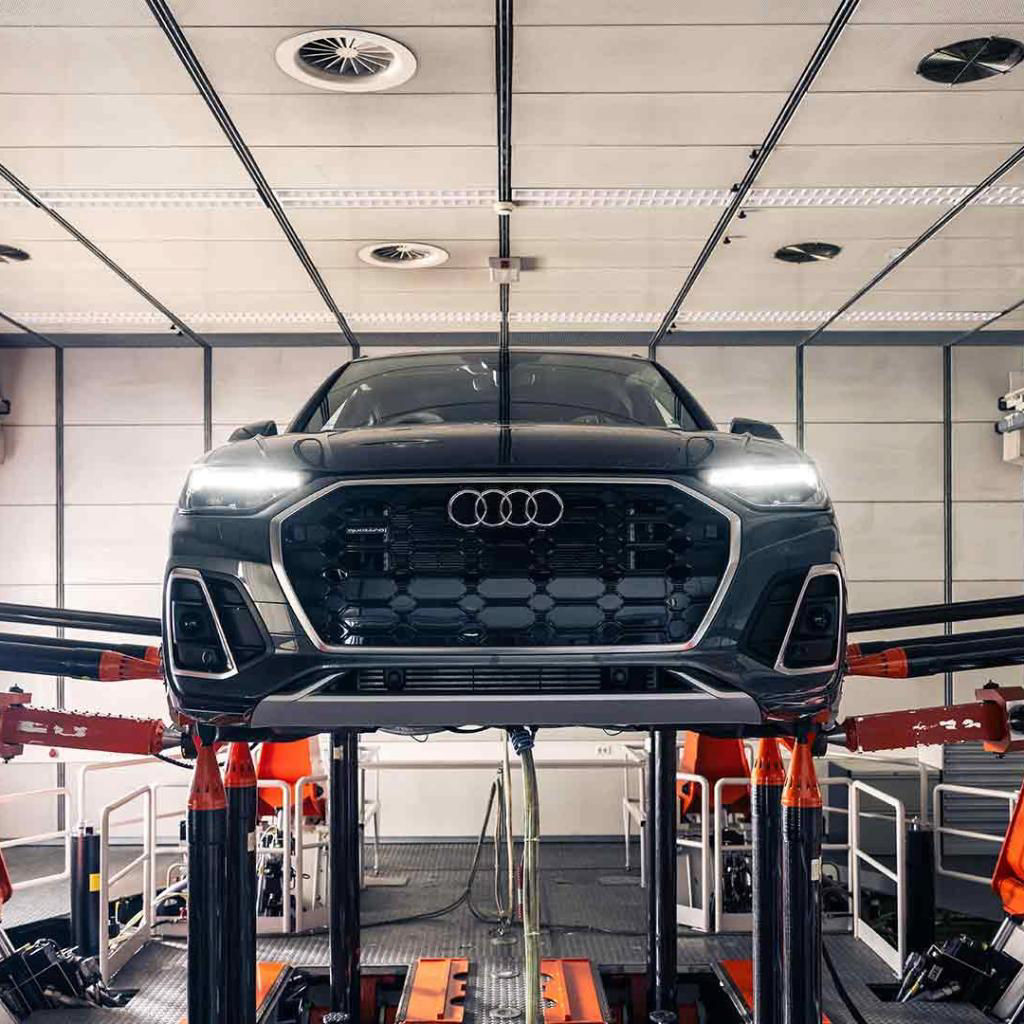 Front profile view of an Audi Q5 vehicle being serviced.
