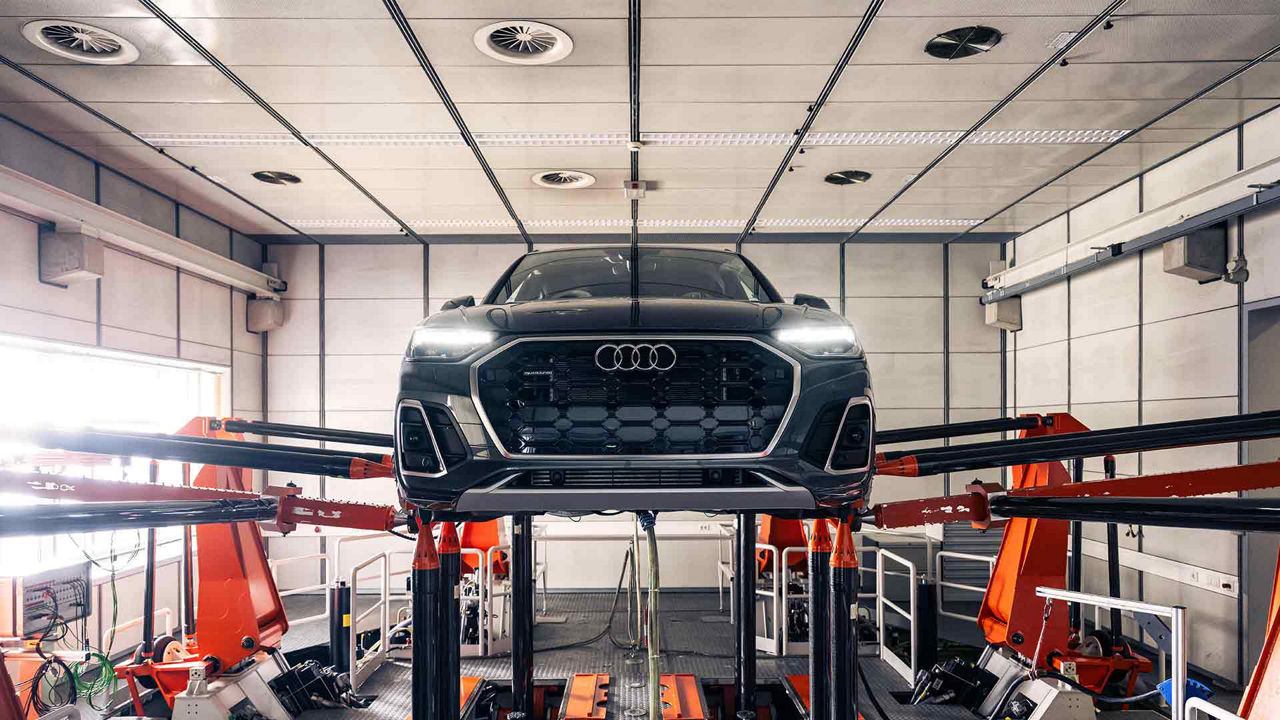 Audi Q5 elevated on a hydraulic lift.
