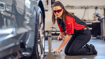 Service technician serving vehicle